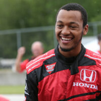 Green Bay Packers quarterback Brett Hundley takes a ride in an INDYCAR at Road America with Mario Andretti
