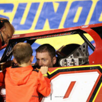 Tim McCreadie talks to his son after winning the North/South 100