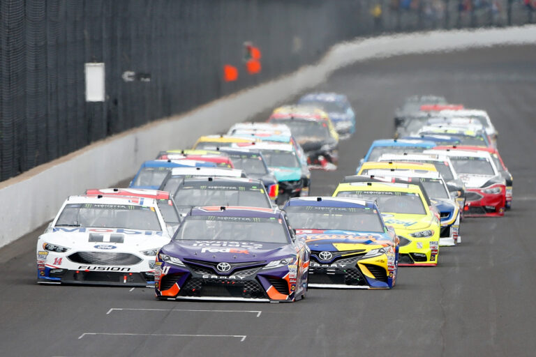 Denny Hamlin leads Clint Bowyer and Kyle Busch at Indianapolis Motor Speedway