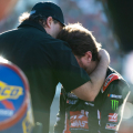 Kurt Busch and car owner Tony Stewart embrace after the NASCAR race at ISM Raceway