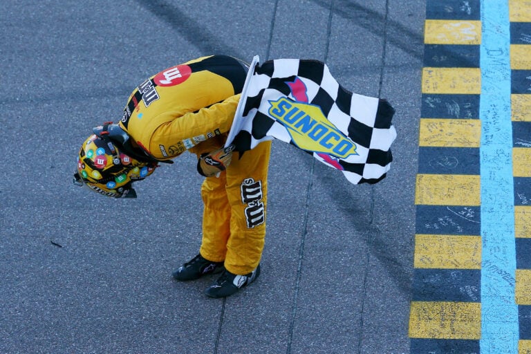 Kyle Busch takes a bow after winning at ISM Raceway
