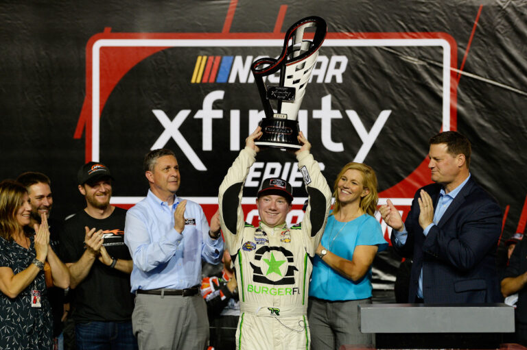 Tyler Reddick, Kelley Earnhardt Miller and Dale Earnhardt Jr with the 2018 NASCAR Xfinity Series championship trophy