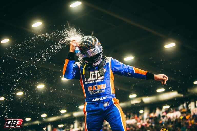 Justin Grant smashes NOS Energy Drink on his helmet after winning in the Chili Bowl Nationals