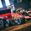 Kyle Larson getting a push from a Jeep Wranger in the Chili Bowl Nationals
