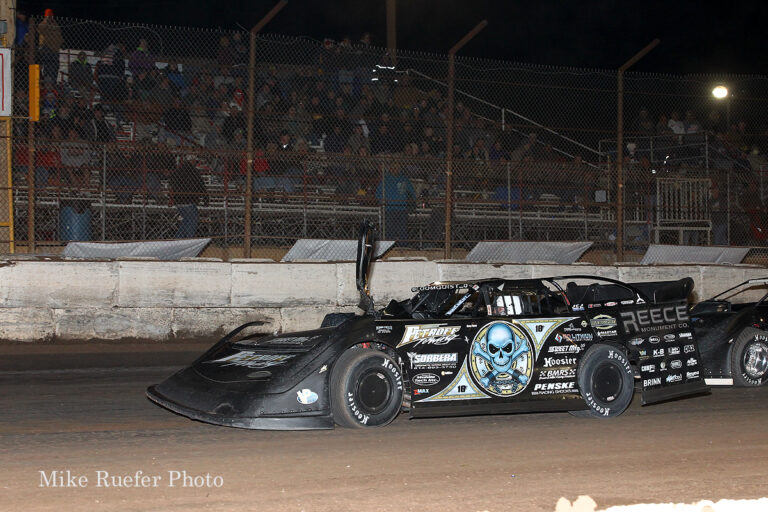 Scott Bloomquist crashes with a lap car while leading in the Wild West Shootout