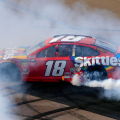 Kyle Busch does a burnout after winning at ISM Raceway - Monster Energy NASCAR Cup Series - TicketGuardian 500