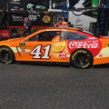 Daniel Suarez - Orange Vanilla Coke NASCAR race car at Talladega Superspeedway