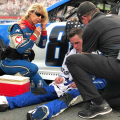 Alex Bowman sits beside his car after the ROVAL at Charlotte Motor Speedway