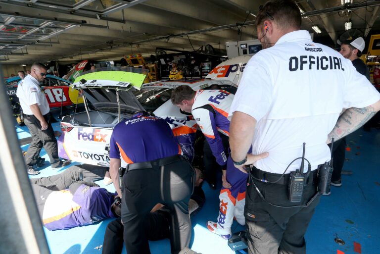 Denny Hamlin crashes in NASCAR Roval practice - NASCAR official in garage area