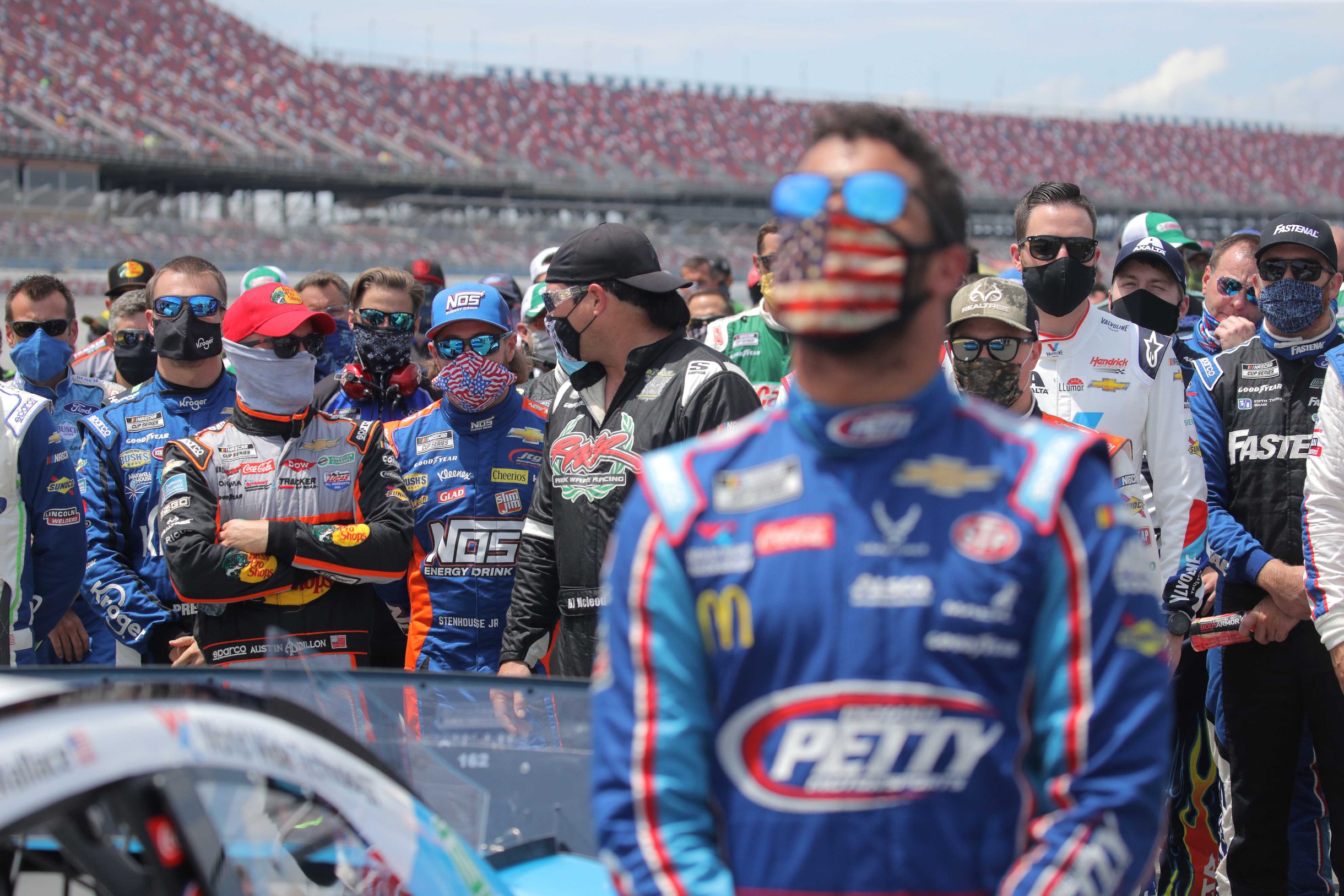 NASCAR drivers stand with Bubba Wallace