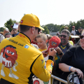 NASCAR driver Kyle Busch signs autographs