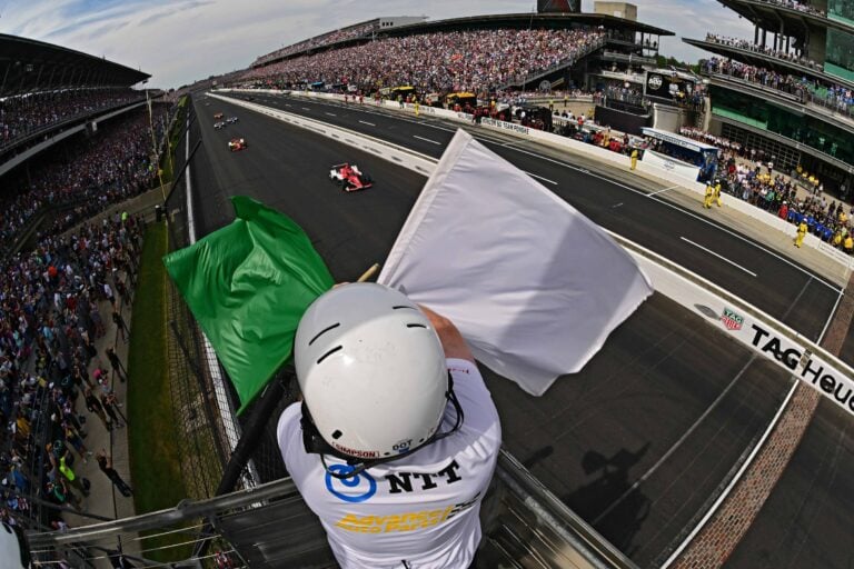 Green and White flags fly - Indycar Series - Indianapolis Motor Speedway - By_ Walt Kuhn