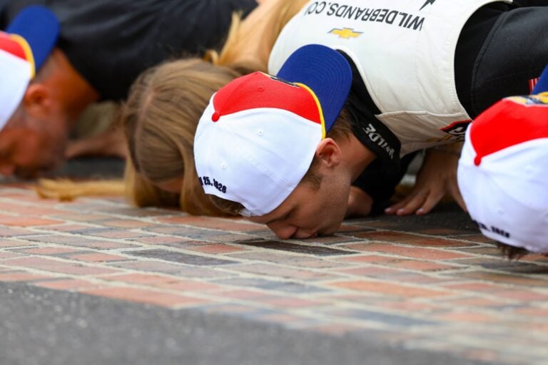 Carson Kvapil kisses the bricks at Indianapolis Motor Speedway - NASCAR O'Reilly Series